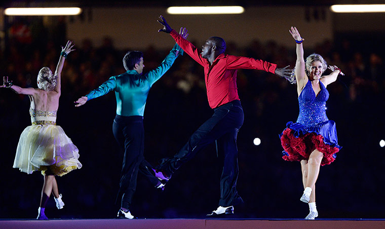 Rugby World Cup 2: Ex England international Martin Offiah (in red) dancing during the opening 