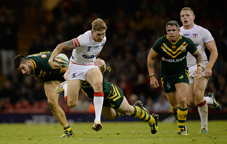 Rugby World Cup 3: Sam Tomkins tries to escape an Australian tackle 