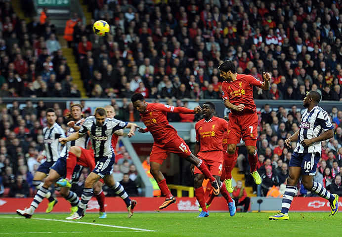 Premier 4: Luis Suarez of Liverpool scores the third goal against West Bromwich Albion