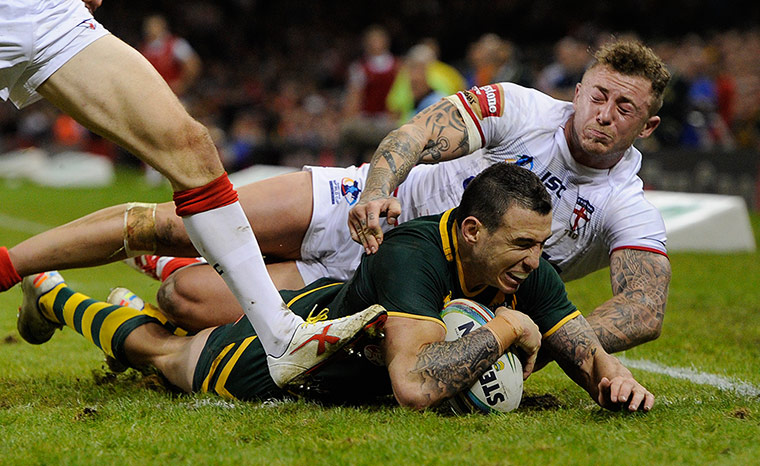 Rugby World Cup 4: Darren Boyd of Australia beats the tackle from Josh Charnley to score the f