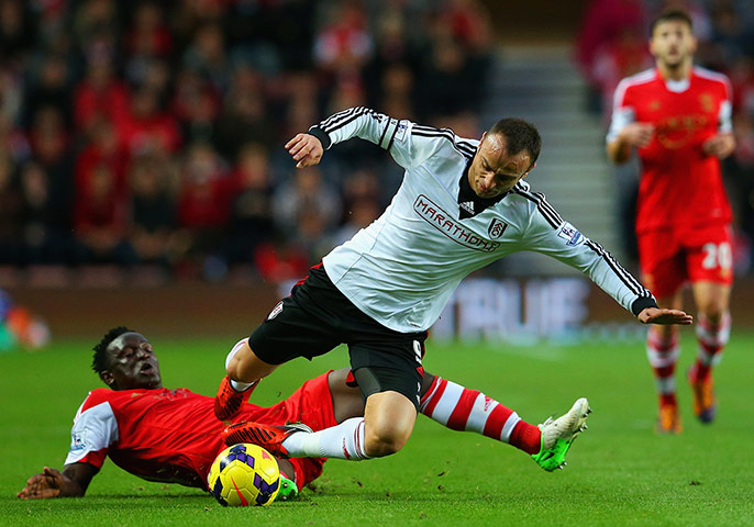 Premier League 5: Danny Fox of Southampton tackles Dimitar Berbatov of Fulham