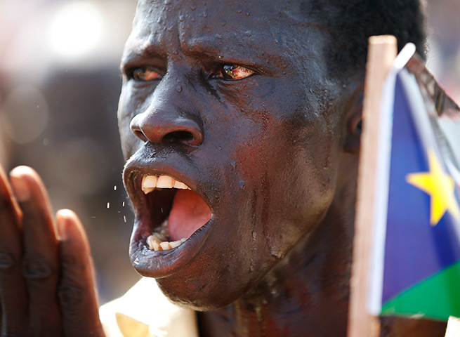 Weekend in pictures: Abyei: A man gestures during a rally before a referendum on whether to join Sudan or South Sudan