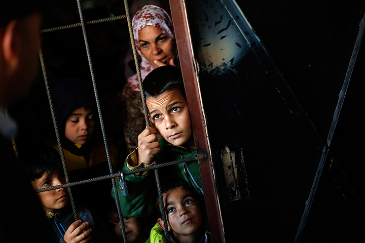 Weekend in pictures: Sofia, Bulgaria: Syrian children wait as Bulgarian doctors perform medical checkups