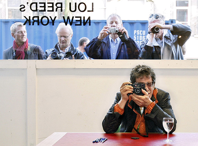 Lou Reed obituary: 2007: Lou Reed takes pictures during the opening of his exhibition Lou Reed's New York at the Serieuze Zaken Studioos in Amsterdam