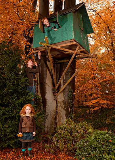 Big Pic - Red Hair: pic of treehouse with girl at bottom of tree and boy at top