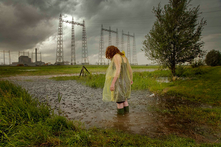Big Pic - Red Hair: woman with red hair standing in flooded landscape