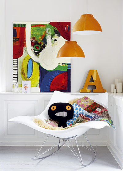 homes - kids: white chair with toys and orange lampshades 