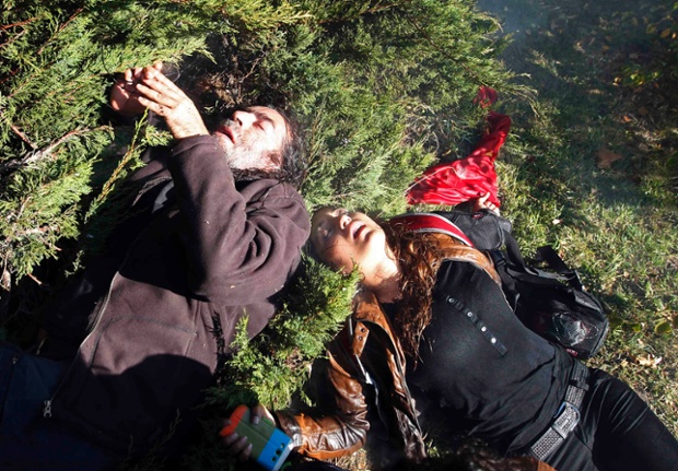 Demonstrators lie on the ground unconscious after riot police used tear gas and water cannon to disperse them during a protest in front of a courthouse in Ankara in Turkey.