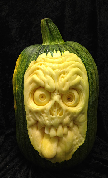 Pumpkin carving: A horror face carved out of a pumpkin