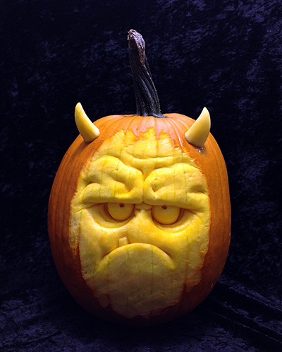 Pumpkin carving: A horror face carved out of a pumpkin