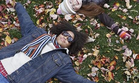 Boy and Girl Lying in Grass
