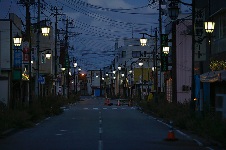 Fukushima: Street lamps light the street in Namie