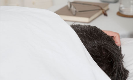 Man asleep under duvet