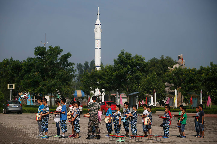 Boot Camp: Young children with their diplomas at a Summer Boot Camp in China