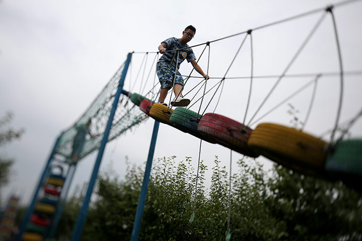 Boot Camp: Traversing the obstacle course at a Summer Boot Camp in China