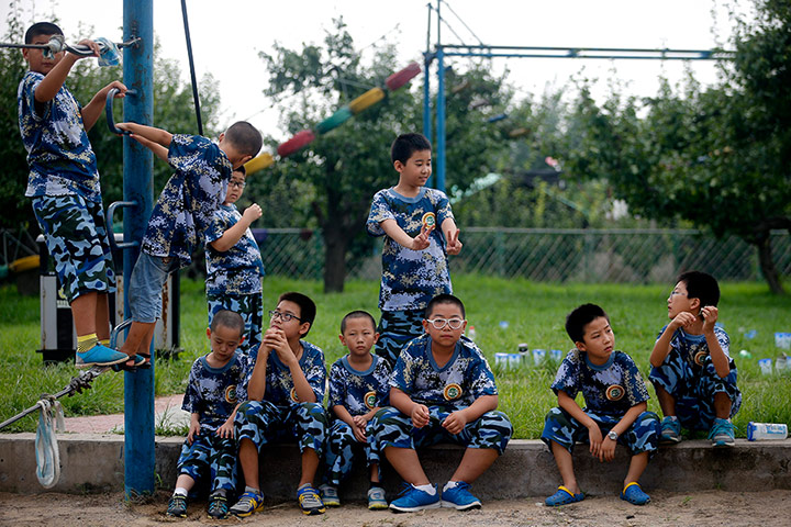 Boot Camp: Youngsters relax as they take a break at a Summer Boot Camp in China