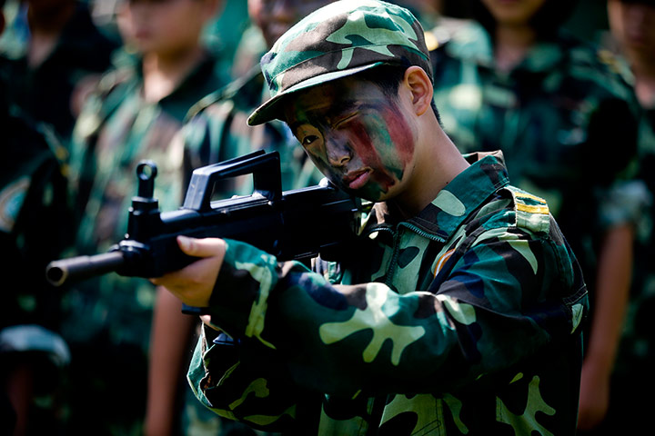Boot Camp: Aiming a mock rifle Summer Boot Camp in China