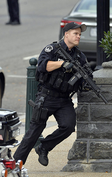 US Capitol Shooting: A policeman runs after shots fired were