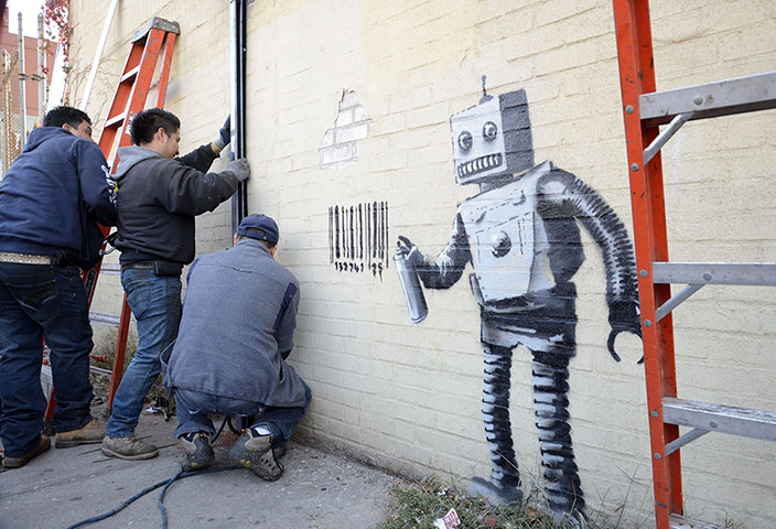 Banksy in NYC update: Robot paints barcode