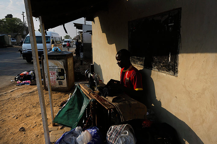 Alexandra Township: A tailor works at his desk