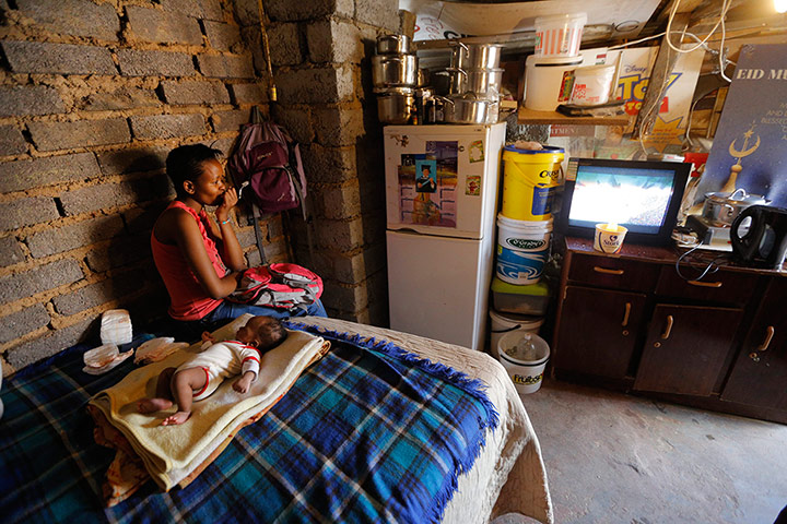 Alexandra Township: A mother watches television