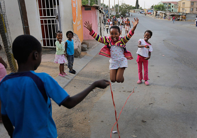 Alexandra Township: Children play a skipping game