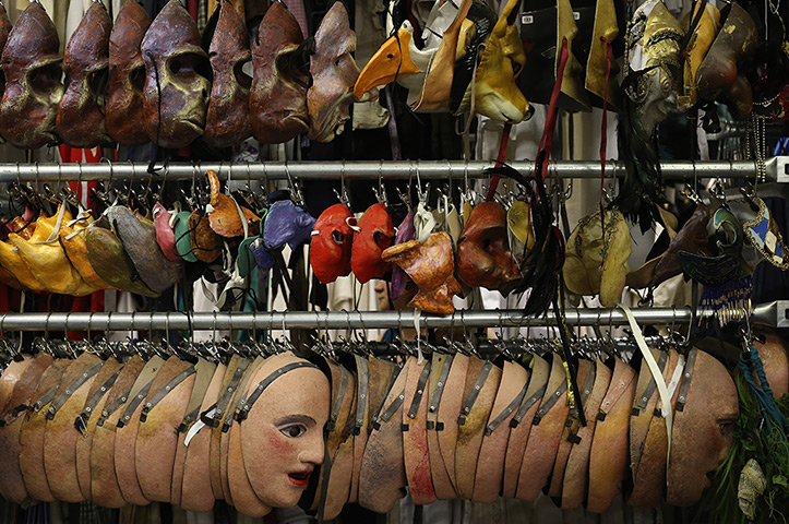 National Theatre props: Masks hang on a rail 