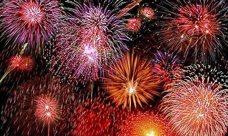 fireworks explode across a night sky