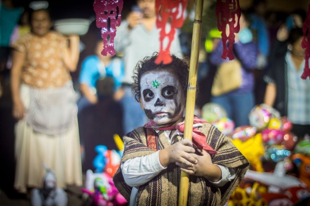 A boy takes part in celebrations for the Day of the Dead in Oaxaca, Mexico.