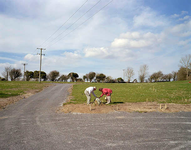 Funerals: Family visit to the grave of a young child, Corofin, County Clare