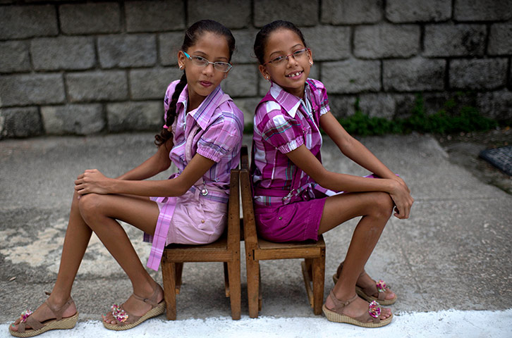 Cuba Twins: Nine-year-old twin sisters Camila, left, and Carla Rodriguez