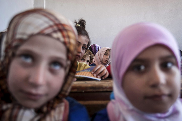 20 Photos: Syrian children attend the public school in Madaya village in Idlib