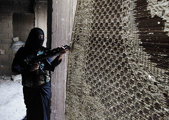 20 Photos: Um Radwan, a female fighter in the Free Syrian Army, in Aleppo
