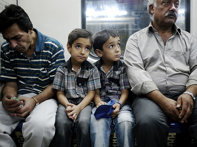 Iranian jeans: Two young twins on the Tehran Metro