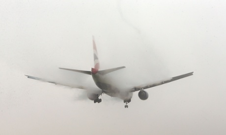 A British Airways planes lands in the fog at Heathrow airport, London.