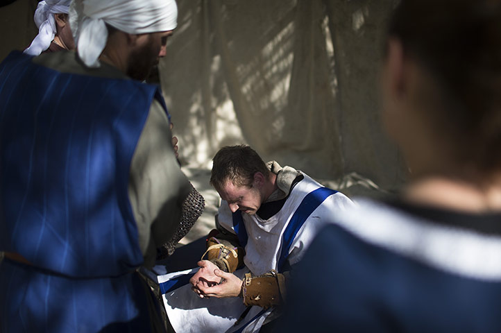 Knights of Jerusalem: A participant is treated after he was injured