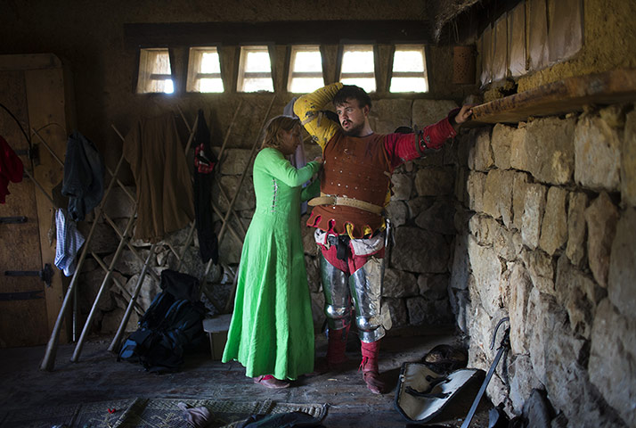 Knights of Jerusalem: A medieval history enthusiast is helped to get undressed 