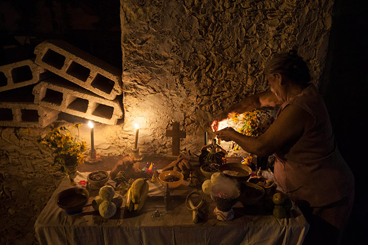 Day of the dead A Maya Indian woman builds an altar in Mexico