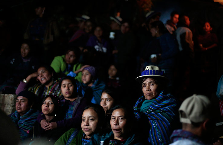 Day of the dead People watch riders performing in Guatemala