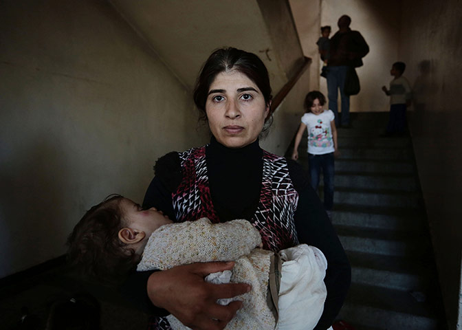 20 Photos: Syrian mother, Manha, and her sick one-year-old baby Ashlem in Sofia
