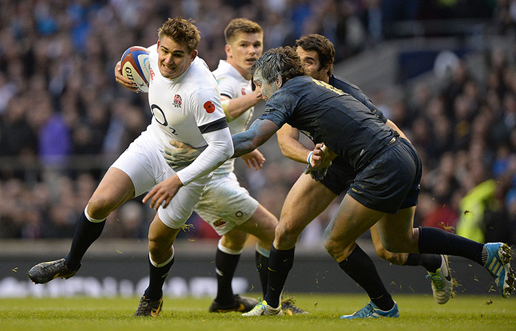 England v Argentina: Toby Flood tries to evade the tackle from Santiago Fernandez 