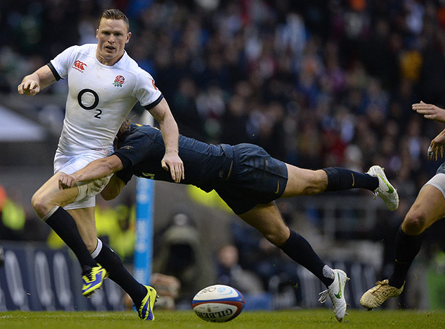 England v Argentina: Chris Ashton is tackled by Santiago Cordero as he chips ahead 