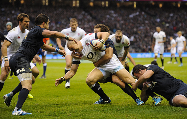 England v Argentina: Mike Brown tries to force his way through