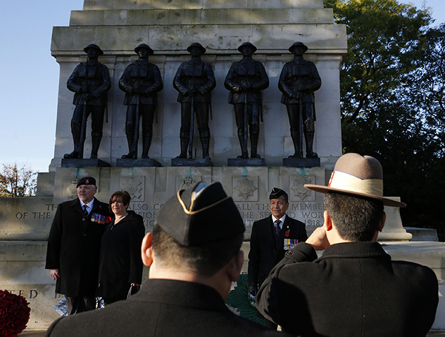 Remembrance Sunday: Ex-servicemen pose for photographs at the Guards Memorial in central London