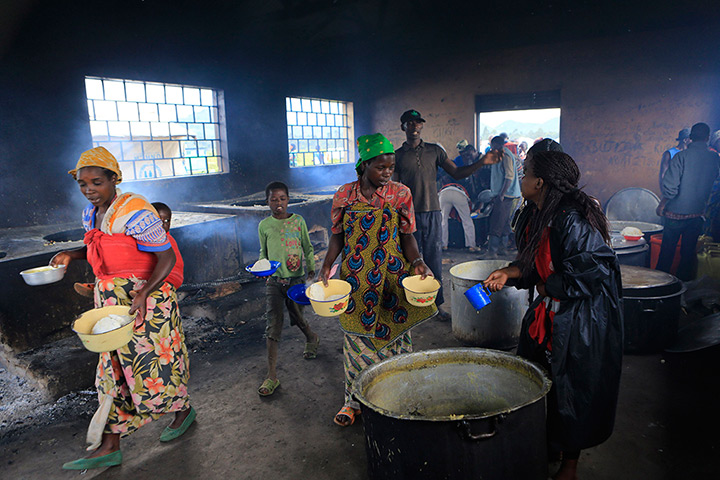 Weekend in pictures: Kisoro district, Uganda: Congolese refugees receive food at the Nyakabande 