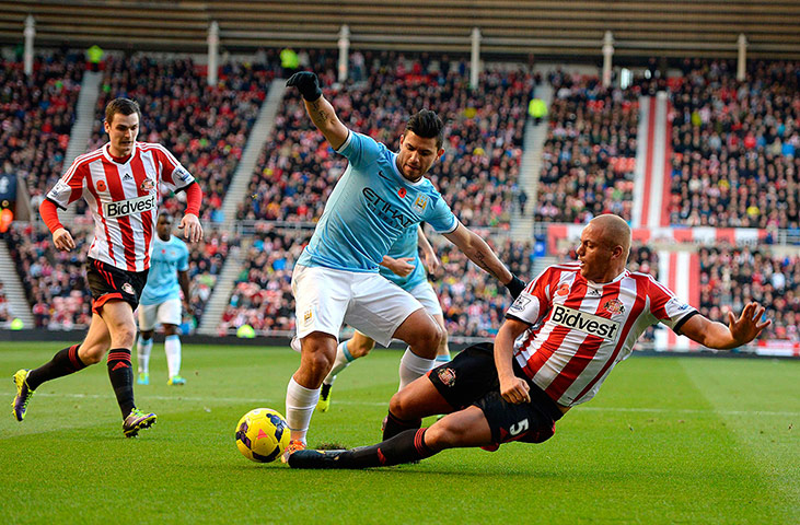 sport: Manchester City's Aguero is challenged
