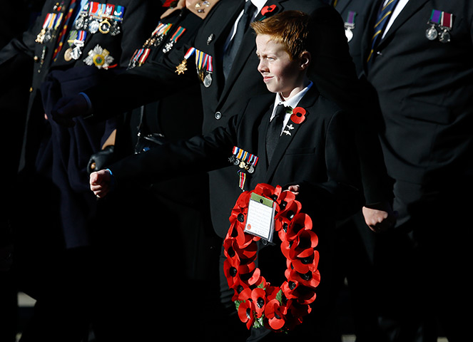 Remembrance Sunday: A young boy holds a wreath during the service of remembrance