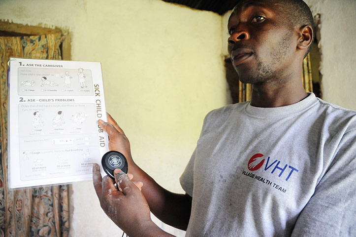 Breath counters in use: Community health worker, Solomon, holding a breath counter