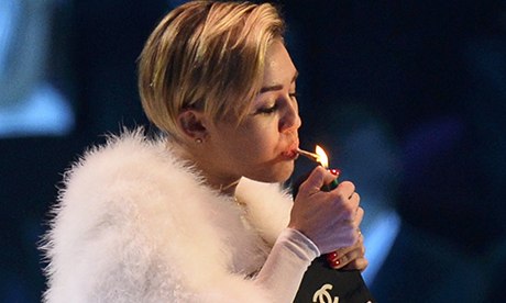 Singer Miley Cyrus smokes on stage in Amsterdam