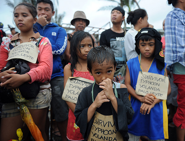 Typhoon Haiyan: Survivors of the super Typhoon Haiyan, wait for a C-130 military plane at T